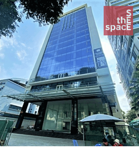 Exterior view of Halo Signature, a contemporary high-rise office building with a full glass curtain wall facade, situated in District 3, Ho Chi Minh City, Vietnam