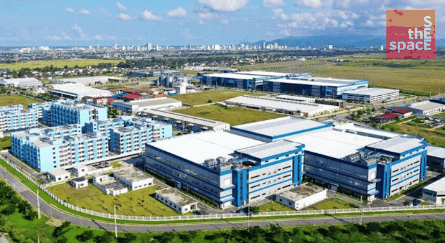 Bird’s-eye view of road infrastructure connecting industrial and urban areas